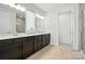 Modern bathroom featuring a double vanity, stylish wood-look tile flooring, and a glass shower at 231 Cotton Ridge Pl, Rock Hill, SC 29730