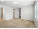 Spacious carpeted bedroom with ample natural light and multiple entryways at 231 Cotton Ridge Pl, Rock Hill, SC 29730