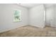 Bright bedroom with a large window and neutral carpet, offering a calming space at 231 Cotton Ridge Pl, Rock Hill, SC 29730