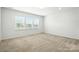 Sunlit bedroom with neutral walls and plush carpeting, perfect for relaxation at 231 Cotton Ridge Pl, Rock Hill, SC 29730