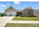 Charming home featuring a manicured lawn, a two-car garage, and a welcoming front entrance at 231 Cotton Ridge Pl, Rock Hill, SC 29730