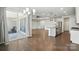 Open-concept kitchen and living area, featuring modern appliances, island, and hardwood floors at 231 Cotton Ridge Pl, Rock Hill, SC 29730
