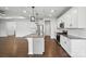 Granite kitchen island with seating, stainless appliances, and pendant lighting, great for entertaining, open to the living area at 231 Cotton Ridge Pl, Rock Hill, SC 29730