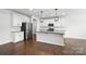 Modern kitchen with stainless steel appliances, granite countertops, and an island with pendant lighting for dining at 231 Cotton Ridge Pl, Rock Hill, SC 29730