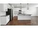Bright kitchen featuring white cabinets, granite counters, stainless appliances, and an island with pendant lighting at 231 Cotton Ridge Pl, Rock Hill, SC 29730