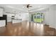 Bright, open-concept space features modern kitchen and a hardwood floor. Sliding door to outdoor space at 231 Cotton Ridge Pl, Rock Hill, SC 29730