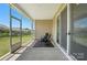 Relaxing screened patio with comfortable seating and view of backyard at 231 Cotton Ridge Pl, Rock Hill, SC 29730