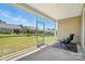 Relaxing screened patio with comfortable seating and view of backyard at 231 Cotton Ridge Pl, Rock Hill, SC 29730