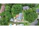 Overhead shot of house with private backyard, wood patio, mature trees and neighborhood pool nearby at 3304 Chilham Pl, Charlotte, NC 28226