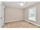 Bedroom with neutral carpet, a ceiling fan, and a bright window at 3304 Chilham Pl, Charlotte, NC 28226