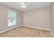 Empty bedroom with a ceiling fan and window at 3304 Chilham Pl, Charlotte, NC 28226