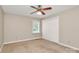 Bedroom featuring carpet, a ceiling fan and closet with paneled doors at 3304 Chilham Pl, Charlotte, NC 28226