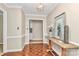 Foyer with beautiful parquet floors, wood trim, and a decorative table with painting at 3304 Chilham Pl, Charlotte, NC 28226