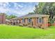 Charming brick home with pristine lawn and manicured landscaping at 3304 Chilham Pl, Charlotte, NC 28226