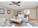Warm living room featuring a sofa, patterned chairs, and natural light at 3304 Chilham Pl, Charlotte, NC 28226