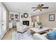 Inviting living room with fireplace, built-in shelving, and comfortable seating at 3304 Chilham Pl, Charlotte, NC 28226