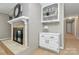 Bright room with a fireplace, shelving, and natural light at 3304 Chilham Pl, Charlotte, NC 28226