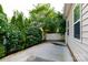 This backyard offers a concrete patio area and a lovely garden at 405 Jenny Skip Ln, Rock Hill, SC 29732