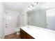 The bathroom boasts a vanity with storage, a sink, a large mirror, and a shower-tub combo at 405 Jenny Skip Ln, Rock Hill, SC 29732