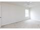 Bedroom with neutral walls and carpet features a window for natural light at 405 Jenny Skip Ln, Rock Hill, SC 29732