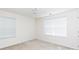 Bright bedroom features neutral walls, carpet, a ceiling fan, and two windows to allow plenty of natural light at 405 Jenny Skip Ln, Rock Hill, SC 29732
