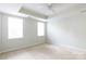 Bright and airy bedroom with neutral carpets, natural light, and ceiling fan at 405 Jenny Skip Ln, Rock Hill, SC 29732