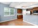 Kitchen with wood cabinets, stainless appliances, adjacent eating area, and bright natural light at 405 Jenny Skip Ln, Rock Hill, SC 29732