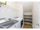 Laundry room with modern appliances, overhead rack and built-in shelving at 405 Jenny Skip Ln, Rock Hill, SC 29732