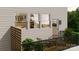 Outdoor deck with seating, potted plants, and a view from the side of the property at 4059 Bass River Pkwy, Charlotte, NC 28217