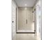 Bathroom glass shower with tile surround, black trim and fixtures at 4059 Bass River Pkwy, Charlotte, NC 28217