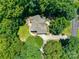 Aerial view of house and property, showcasing surrounding mature trees and landscaping at 413 Farm Branch Dr, Fort Mill, SC 29715