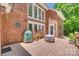 Brick home with a patio and outdoor seating including a grill and a firepit at 413 Farm Branch Dr, Fort Mill, SC 29715