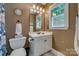 Bathroom featuring a white vanity, toilet and walk-in shower with a blue shower curtain at 413 Farm Branch Dr, Fort Mill, SC 29715