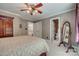 Bedroom with a large bed, wardrobe, and a view into the ensuite bathroom at 413 Farm Branch Dr, Fort Mill, SC 29715