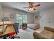 Bedroom with a ceiling fan, a desk, a bed, a lounge chair and ample natural light at 413 Farm Branch Dr, Fort Mill, SC 29715