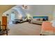 Large bonus room with beds, an exercise bike and multiple seating areas at 413 Farm Branch Dr, Fort Mill, SC 29715