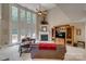 Bright living room featuring fireplace, tall windows, and natural light at 413 Farm Branch Dr, Fort Mill, SC 29715
