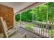Relax on this covered porch with views of the lush and tree-lined surroundings at 413 Farm Branch Dr, Fort Mill, SC 29715