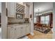 Wet bar featuring a sink, wine storage, granite countertops and white cabinets at 413 Farm Branch Dr, Fort Mill, SC 29715
