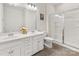 Bright bathroom featuring a double sink vanity and glass-enclosed shower at 4261 Coachwhip Ave, Lancaster, SC 29720