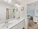 Bright bathroom with a double sink vanity and a view into the bedroom at 4261 Coachwhip Ave, Lancaster, SC 29720