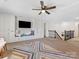 Bonus room featuring built-in cabinets, bench seating, and a ceiling fan at 4261 Coachwhip Ave, Lancaster, SC 29720