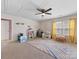 Spacious bonus room featuring a ceiling fan and play area at 4261 Coachwhip Ave, Lancaster, SC 29720