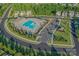 Aerial view of the community pool featuring a zero entry access, ample parking and manicured landscaping at 4261 Coachwhip Ave, Lancaster, SC 29720