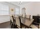 Formal dining room showcasing a large table with seating for eight, enhanced by natural light at 4261 Coachwhip Ave, Lancaster, SC 29720