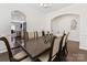 Formal dining room with a large table and access to the kitchen through an arched doorway at 4261 Coachwhip Ave, Lancaster, SC 29720