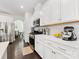 Spacious kitchen featuring white cabinets, quartz countertops, and modern appliances at 4261 Coachwhip Ave, Lancaster, SC 29720