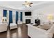 Cozy living room features a fireplace, neutral furniture, a ceiling fan, and plenty of natural light at 4261 Coachwhip Ave, Lancaster, SC 29720