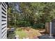 Lush backyard surrounded by trees, with a view of the deck, creating a private outdoor retreat at 432 English Ivy Ct, Fort Mill, SC 29715