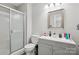 This well-lit bathroom features a shower and tub combo plus a gray vanity with modern finishes at 432 English Ivy Ct, Fort Mill, SC 29715